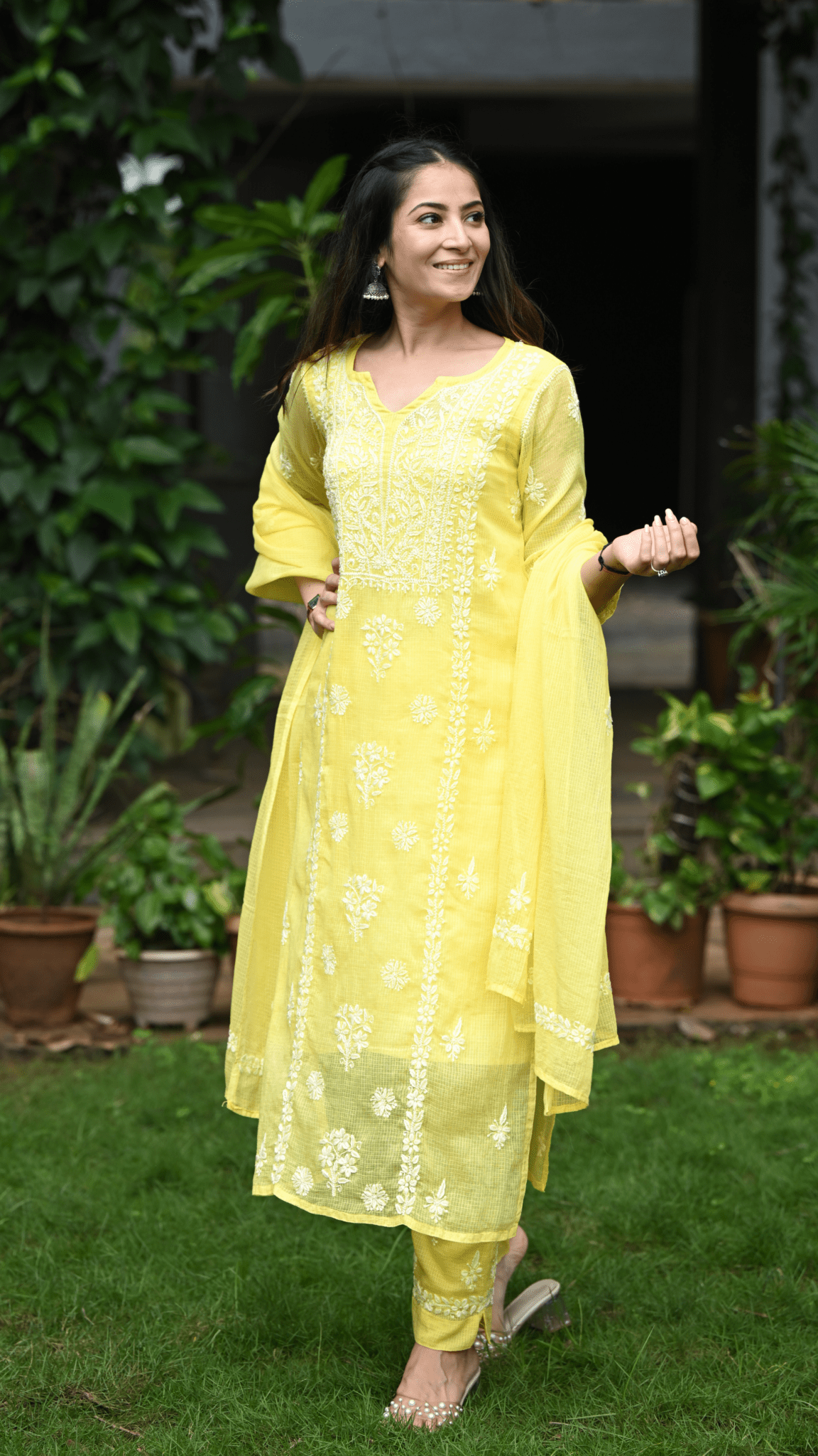 Woman wearing a yellow chikankari outfit with a dupatta by Pakke Dhaage
