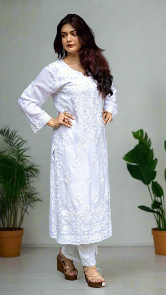 Woman wearing a white traditional handmade chikankari outfit